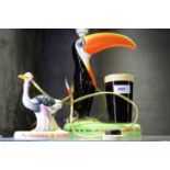 A Carlton Ware Guinness toucan ceramic table lamp and another.