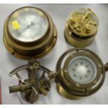 Four brass navigation instruments.