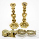 A set of Victorian brass sovereign scales, and a pair of brass taper sticks.