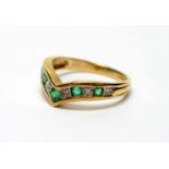 An emerald and diamond ring,