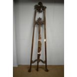 An ornate vintage stained beech easel.