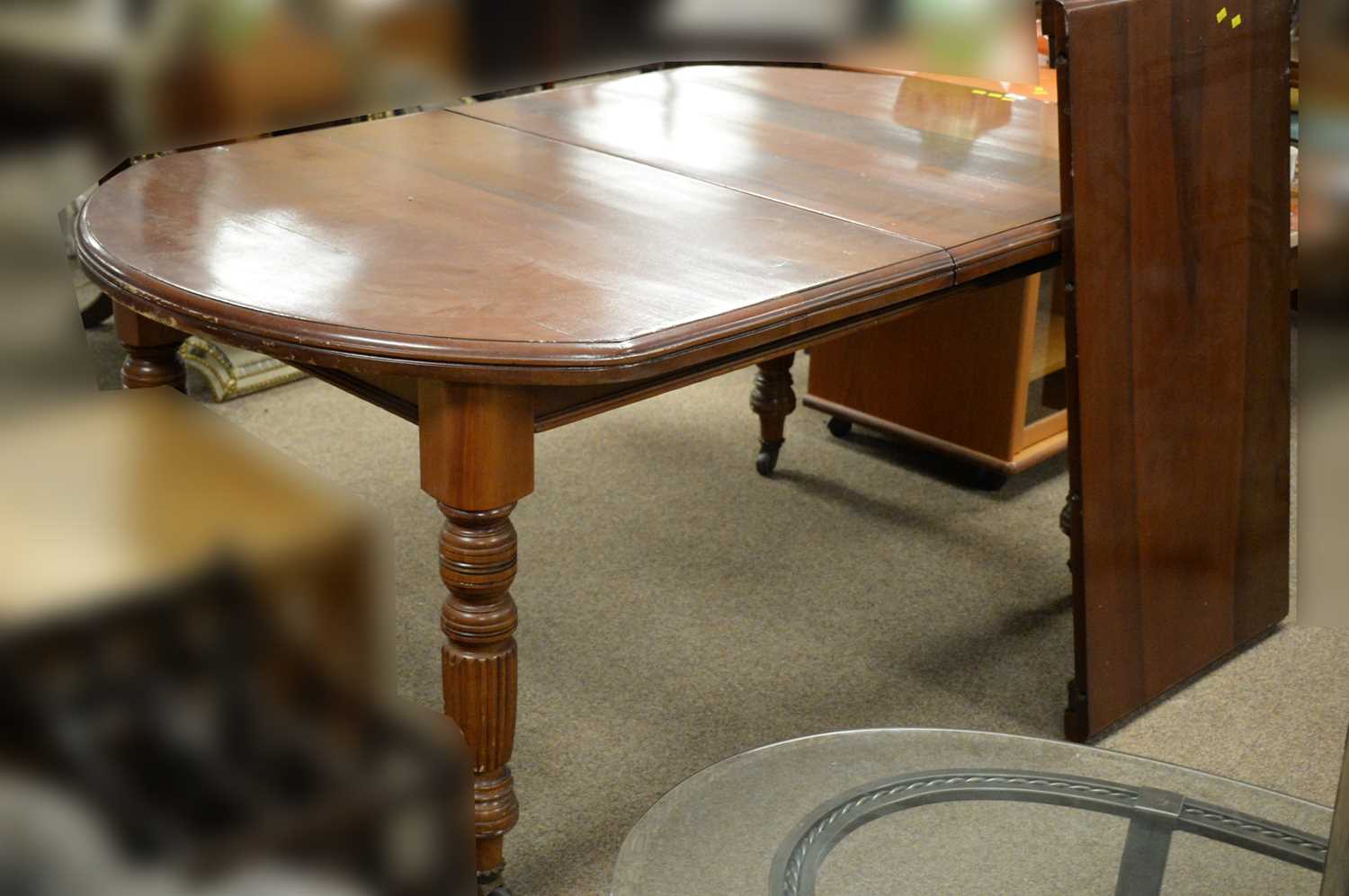 An early 20th Century walnut extending dining table