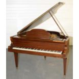 Mahogany-cased baby grand piano.