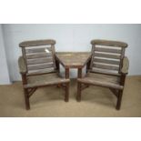 Weathered teak two-seater garden seat.