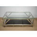 Chromed metal and glass top coffee table.