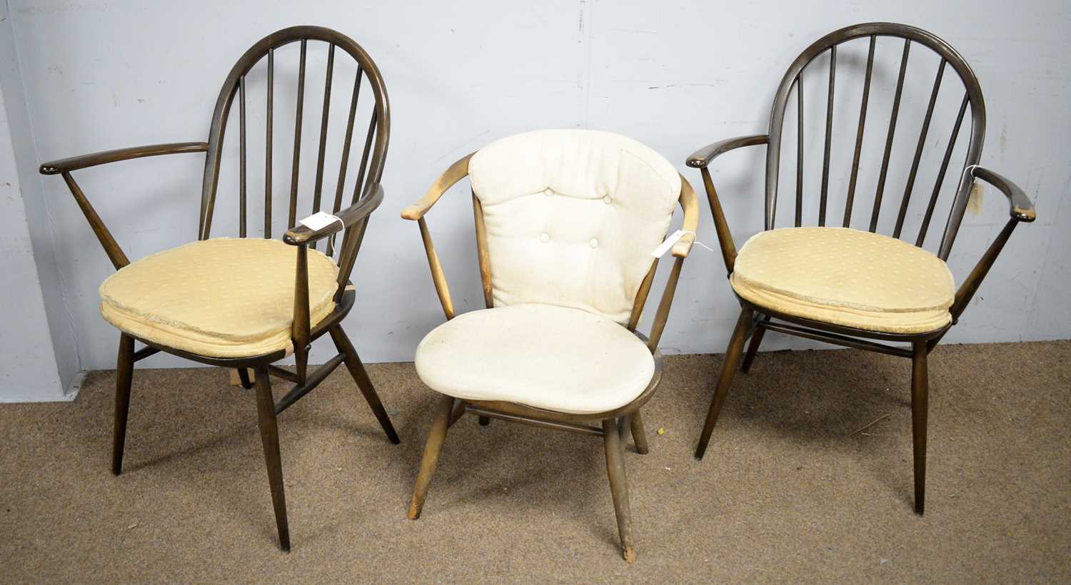 Three Ercol open arm chairs.