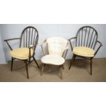 Three Ercol open arm chairs.