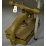 A cast-iron book press.