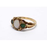 An opal and emerald ring