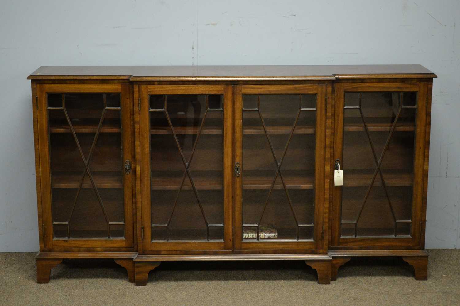 Reproduction mahogany breakfront bookcase.