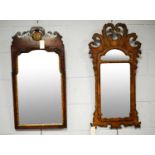 Two Georgian-style wall mirrors.