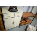 1950's kitchen cabinet; and a 1970's food trolley.
