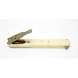 A late 19th Century ivory quill cutter