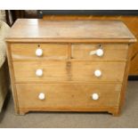 A Victorian stripped pine chest of drawers.