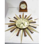 A sunburst clock; and a mantel clock.