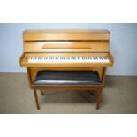 Danemann: an upright overstrung piano; and a duet piano stool.