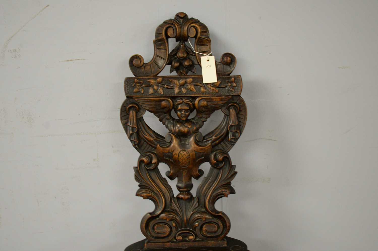 A late 19th Century continental carved oak hall chair - Image 3 of 3