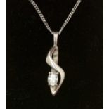 A diamond and palladium pendant,