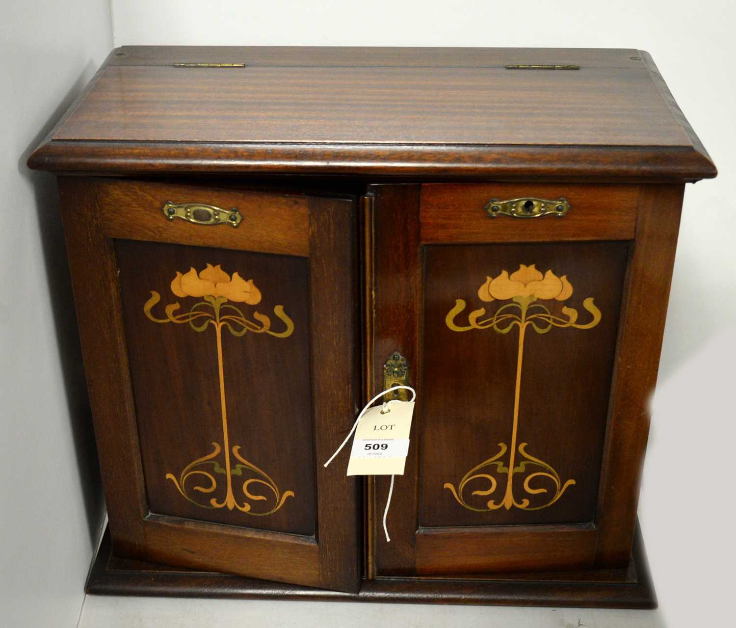 An Edwardian mahogany inlaid smoker's cabinet.