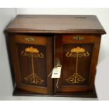 An Edwardian mahogany inlaid smoker's cabinet.