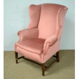 A Victorian wingback armchair