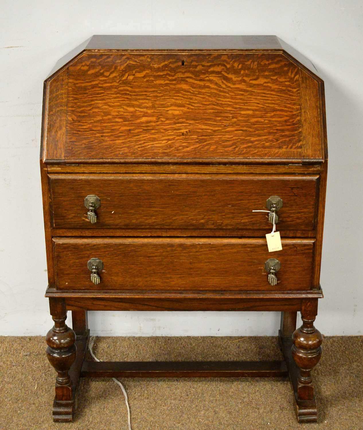 A 1930s oak writing bureau