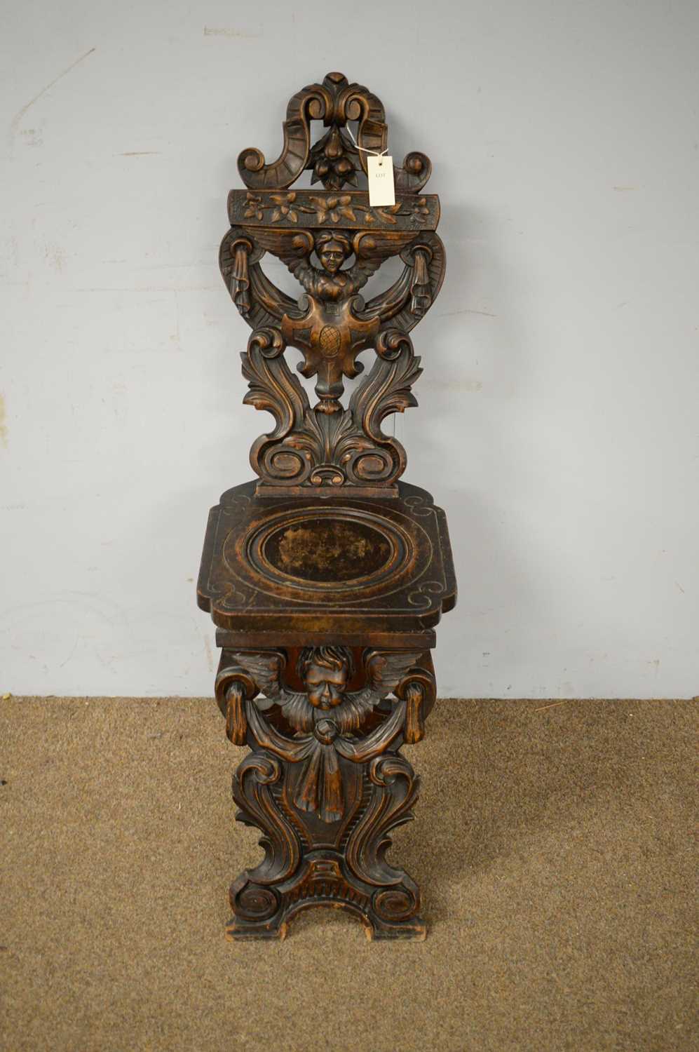 A late 19th Century continental carved oak hall chair - Image 2 of 3