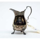 A silver cream jug, by Charles Weale