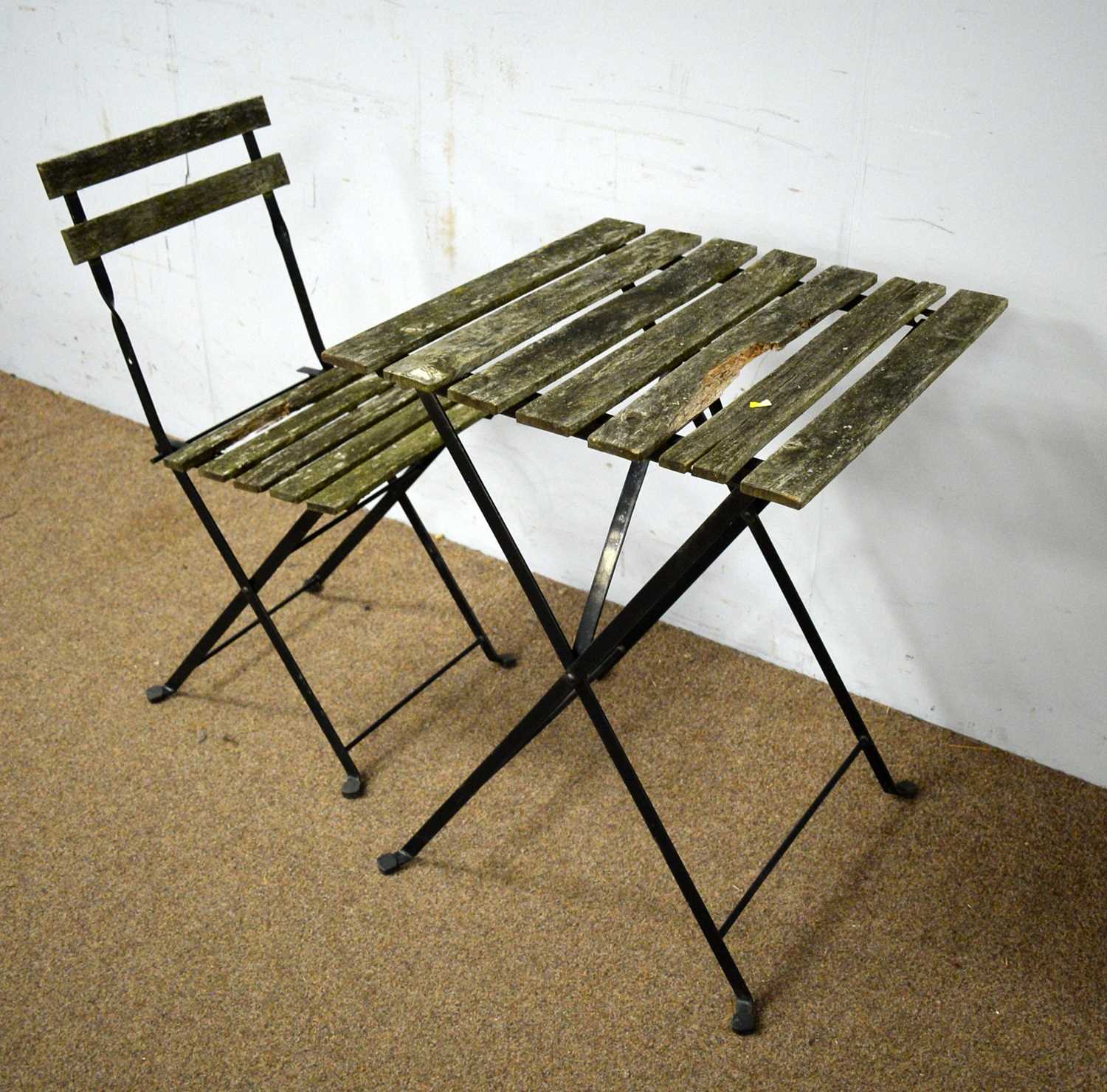 A contemporary teak and cast metal garden table - Image 2 of 2