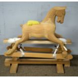 A late 20th Century carved rocking horse