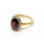 A garnet and diamond cluster ring,