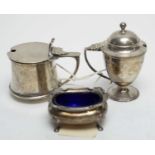 Two silver mustard pots and a table salt.