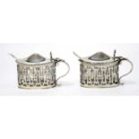 A pair of George V silver mustard pots,