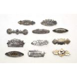A collection of silver Victorian and early 20th Century brooches,