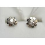 A pair of 18ct white gold and diamond stud earrings