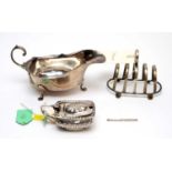 Silver toast rack, sauce boat and mustard pot.