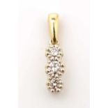 A three stone diamond pendant,