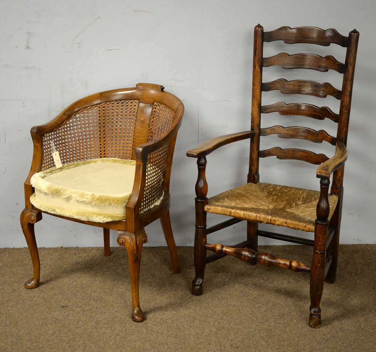 A 19th Century oak ladderback armchair and another chair