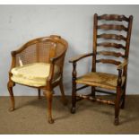 A 19th Century oak ladderback armchair and another chair