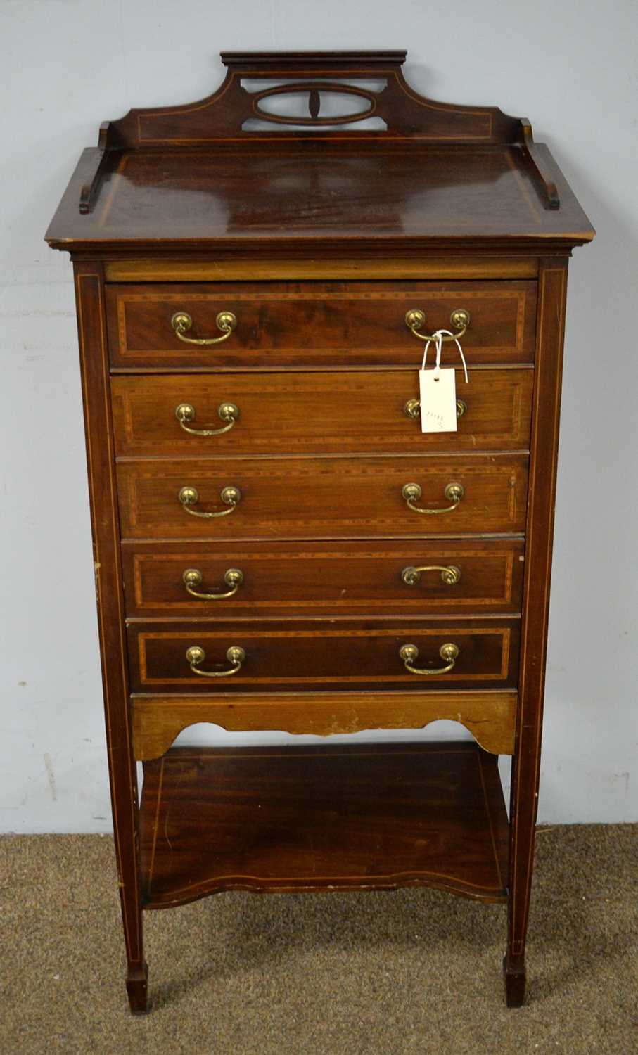 An Edwardian mahogany and satinwood banded music cabinet