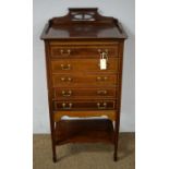 An Edwardian mahogany and satinwood banded music cabinet