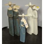 Two Lladro figure groups of nuns; and a single nun.