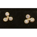 A pair of diamond earrings,