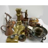 A collection of copper and brassware.