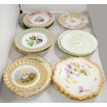 An assorted selection of decorative cabinet plates.