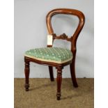 A 20th Century mahogany child’s balloon back chair