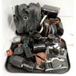 A collection of cameras and camera accessories.