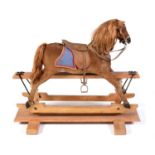 A 19th Century German skin covered rocking horse