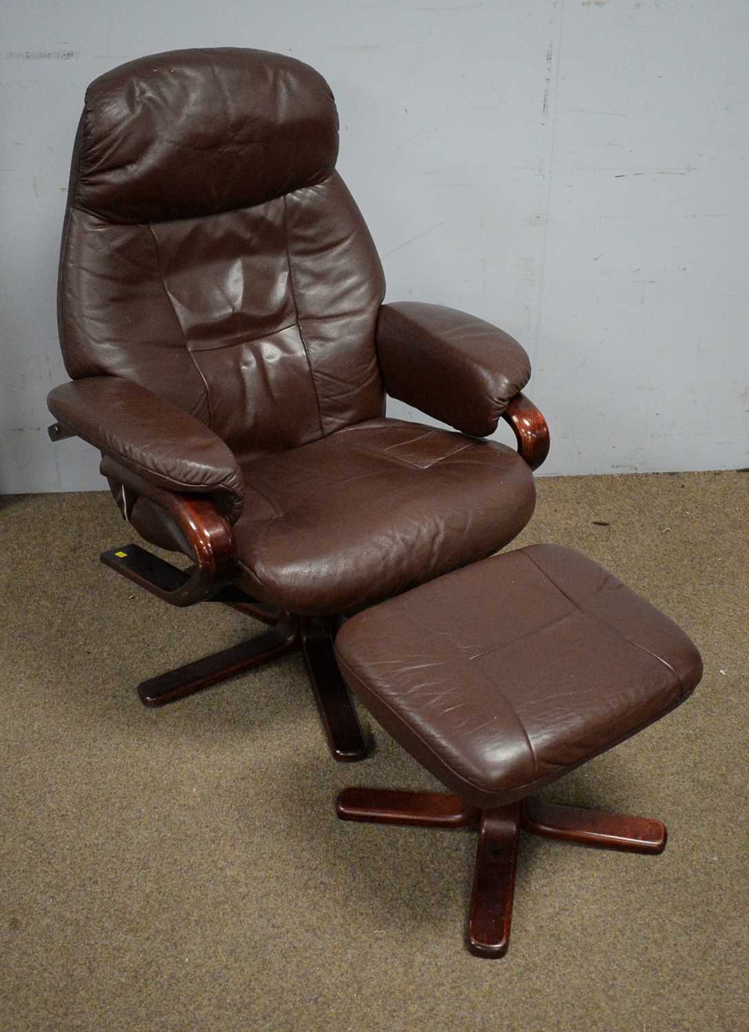 Somo A/S: a maroon leather upholstered easy recliner armchair and footstool.