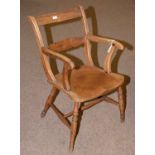A rustic elm solid seat open armchair.